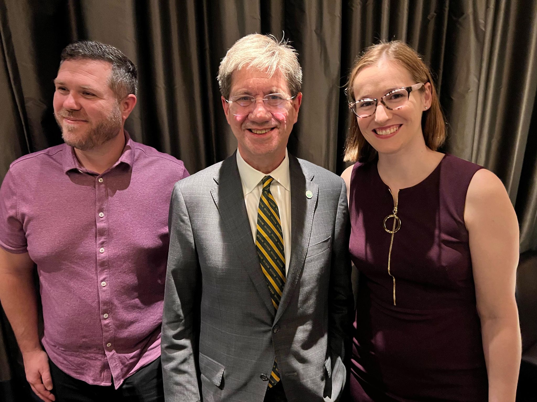 Dr. Nemtiz posed with two alumni at 50th event March 25, 2022.